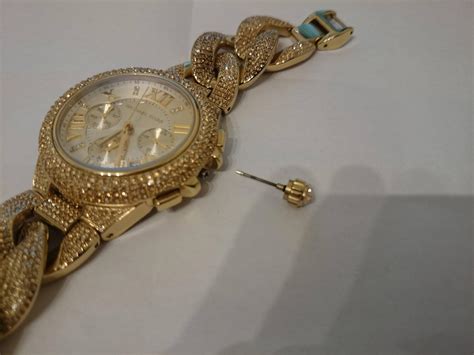 michael kors watch back won't go back on